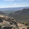 Image of desert landscape. Craigy mountains and winding road. 